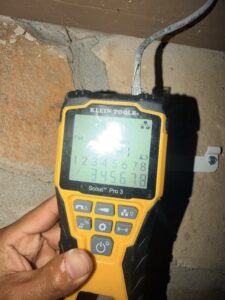 Technician testing security camera network cabling